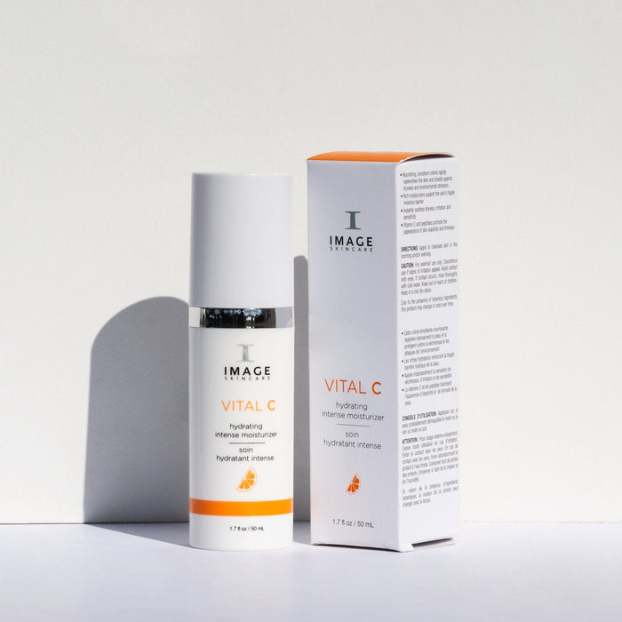 VITAL C hydrating intense moisturizer | IMAGE Skincare bottle and box with white and orange packaging, displayed on a white surface with soft shadow.