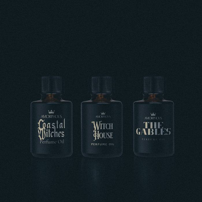 A collection of witch themed perfumes on a black background.