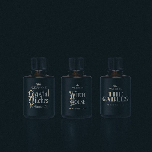 A collection of witch themed perfumes on a black background.