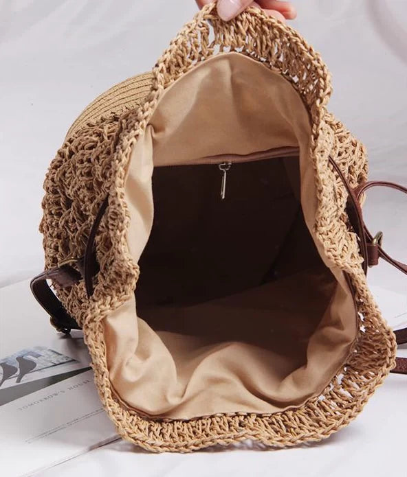 Women’s camel raffia bucket handbag by Grace Beauty featuring woven texture and sturdy handles.